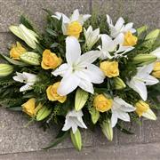 Yellow and white funeral spray